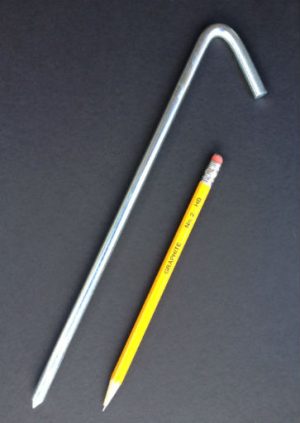 10 inch long steel tarp stake with zinc electroplated protective finish with pencil for scale