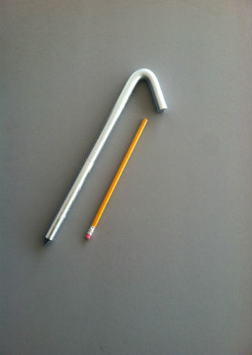 12 inch long hook style steel stake with an electroplated protective finish and a pencil for scale