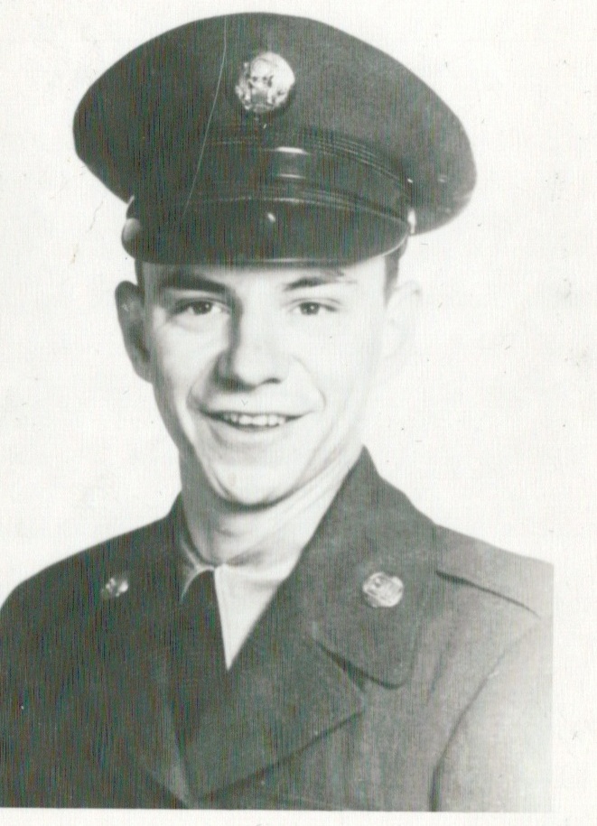 black and white photograph of a young man in a military uniform smiling at the camera